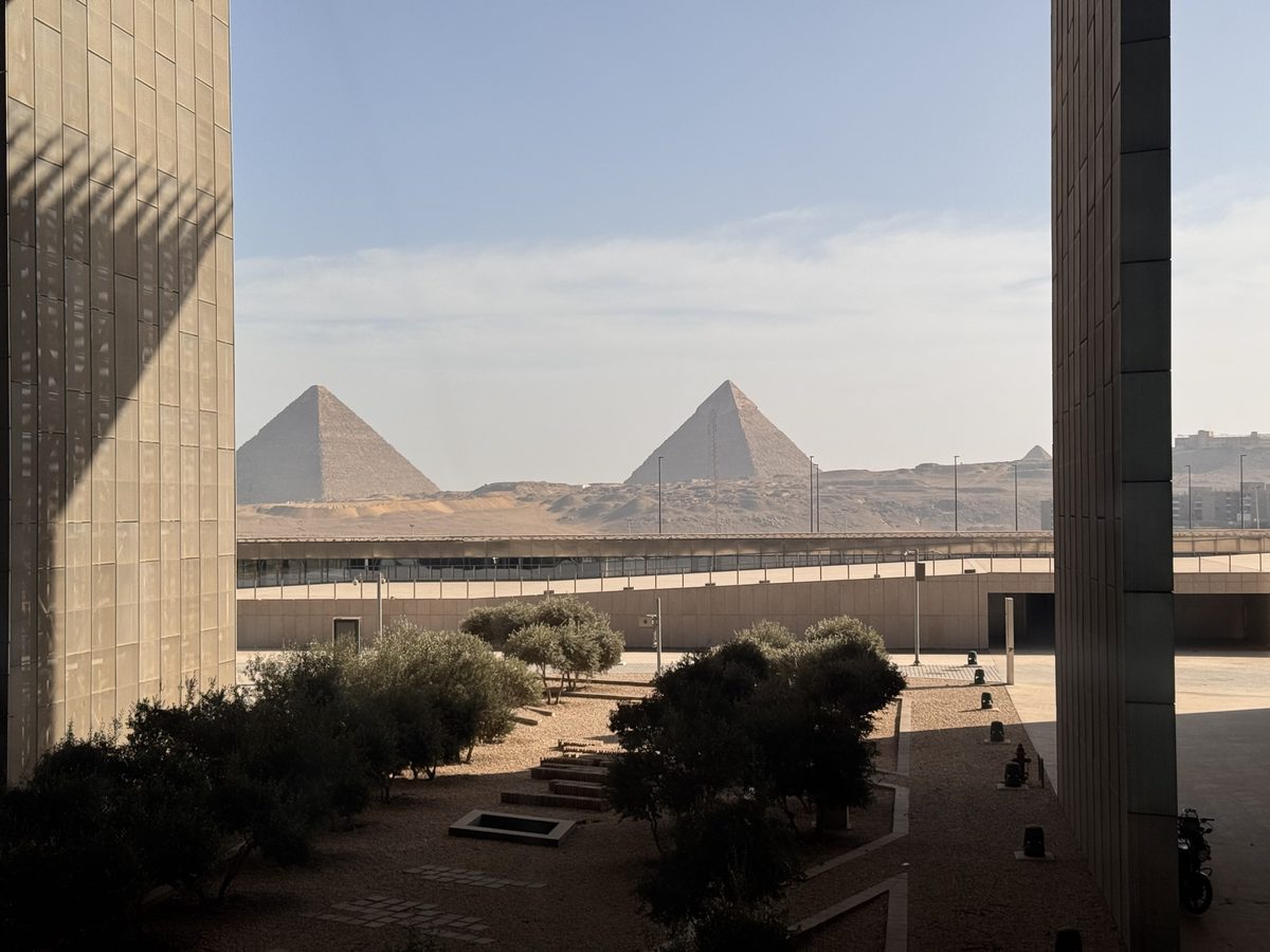 The pyramids seen through the courtyard of the Grand Egyptian Museum